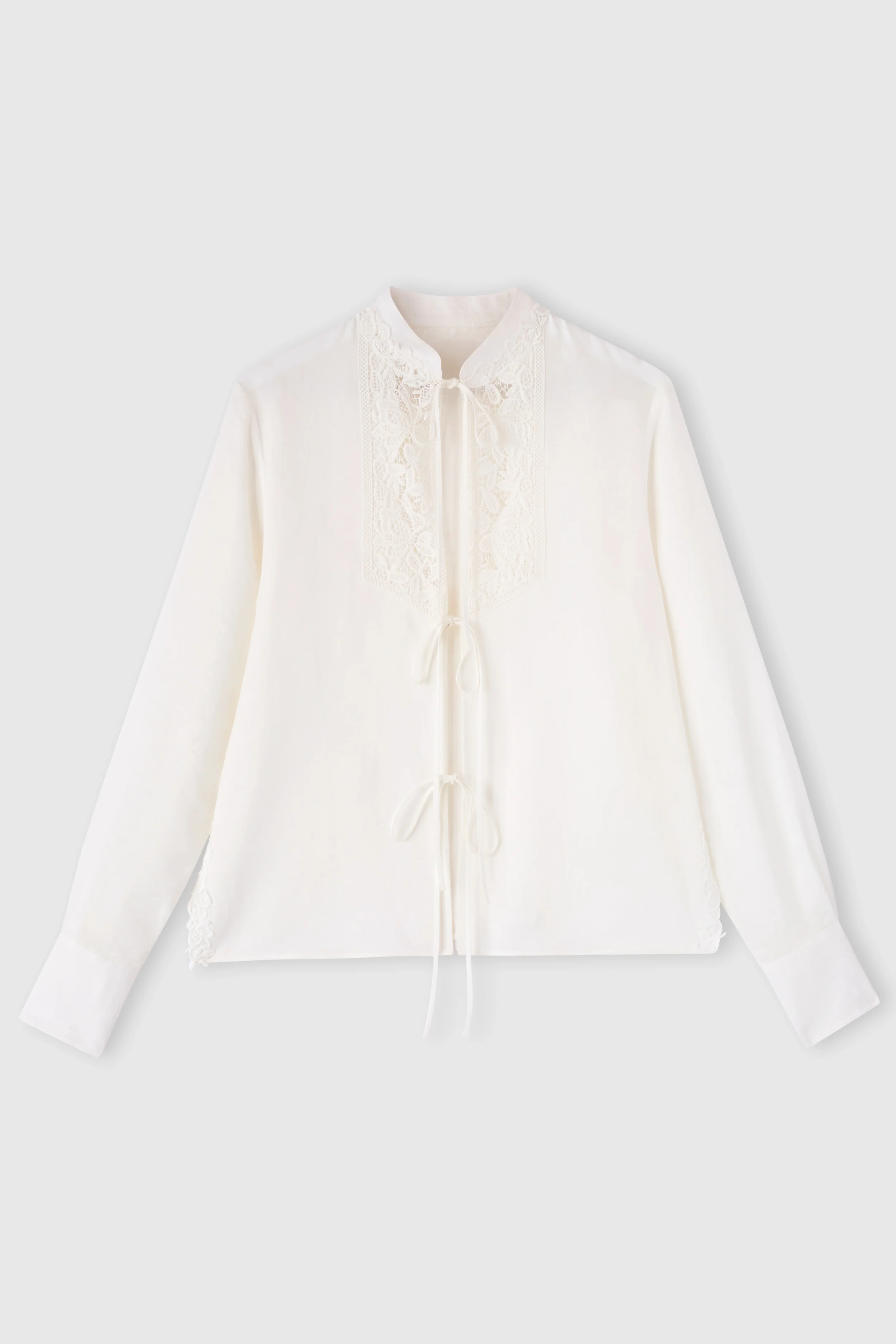 Linen blouse with ties and floral rebrodé lace